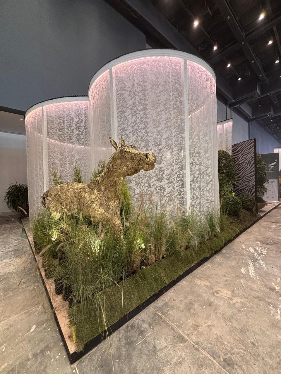 Exhibition image with a deer sculpture