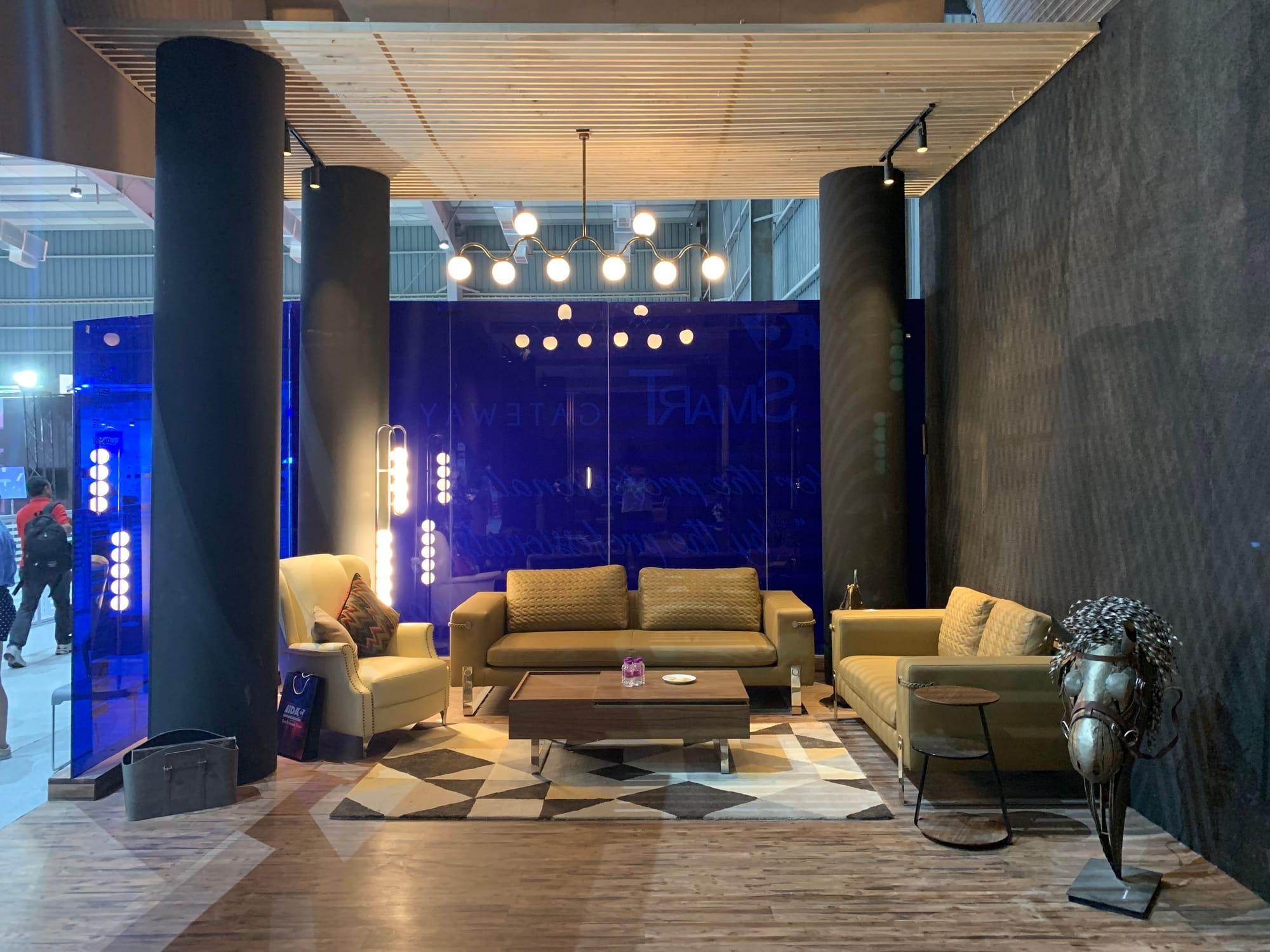 iDAC 2019 VIP Lounge — sofas beneath the chandelier