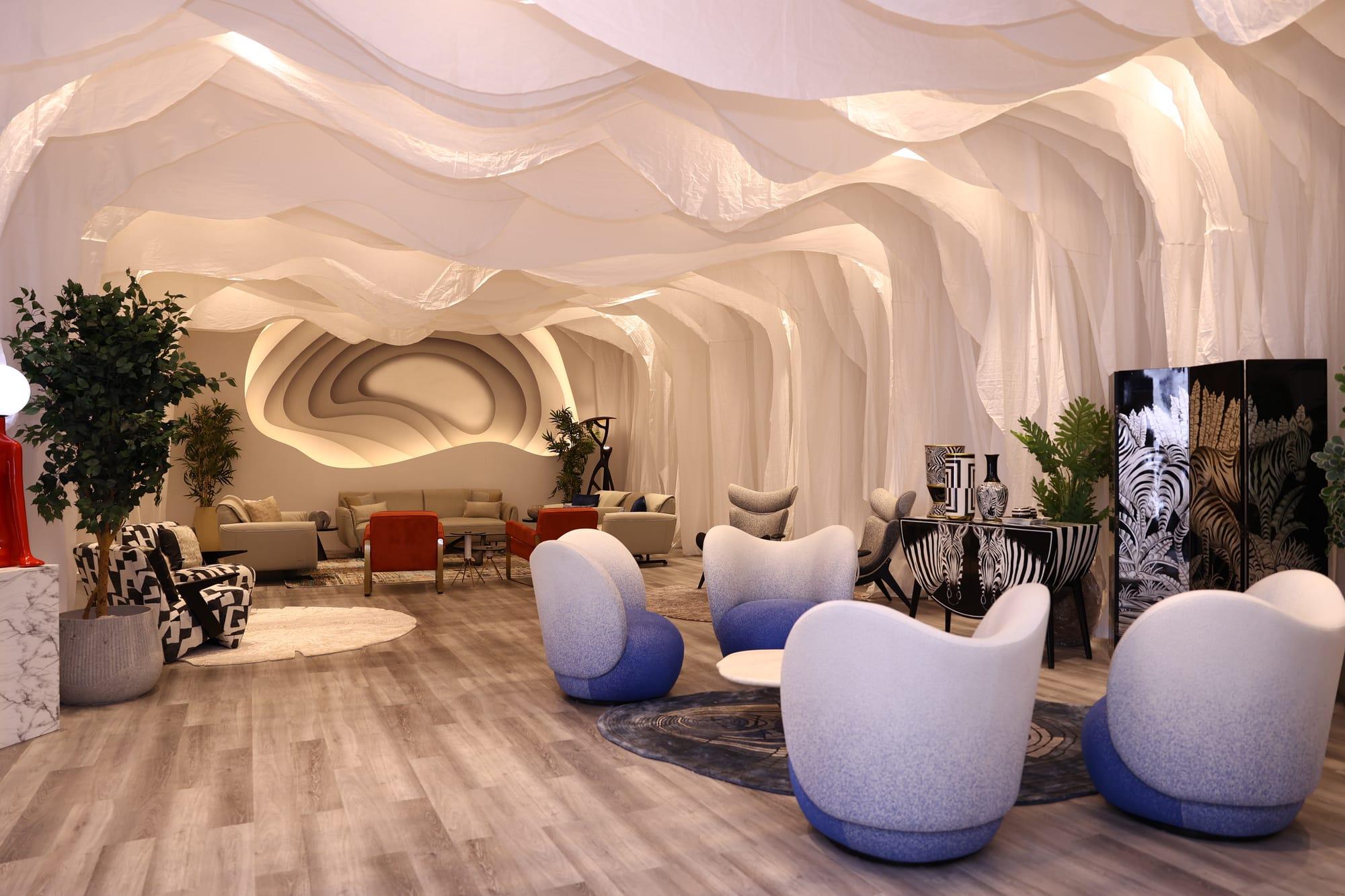 iDAC 2025 VIP Lounge — draped ceiling and blue seating