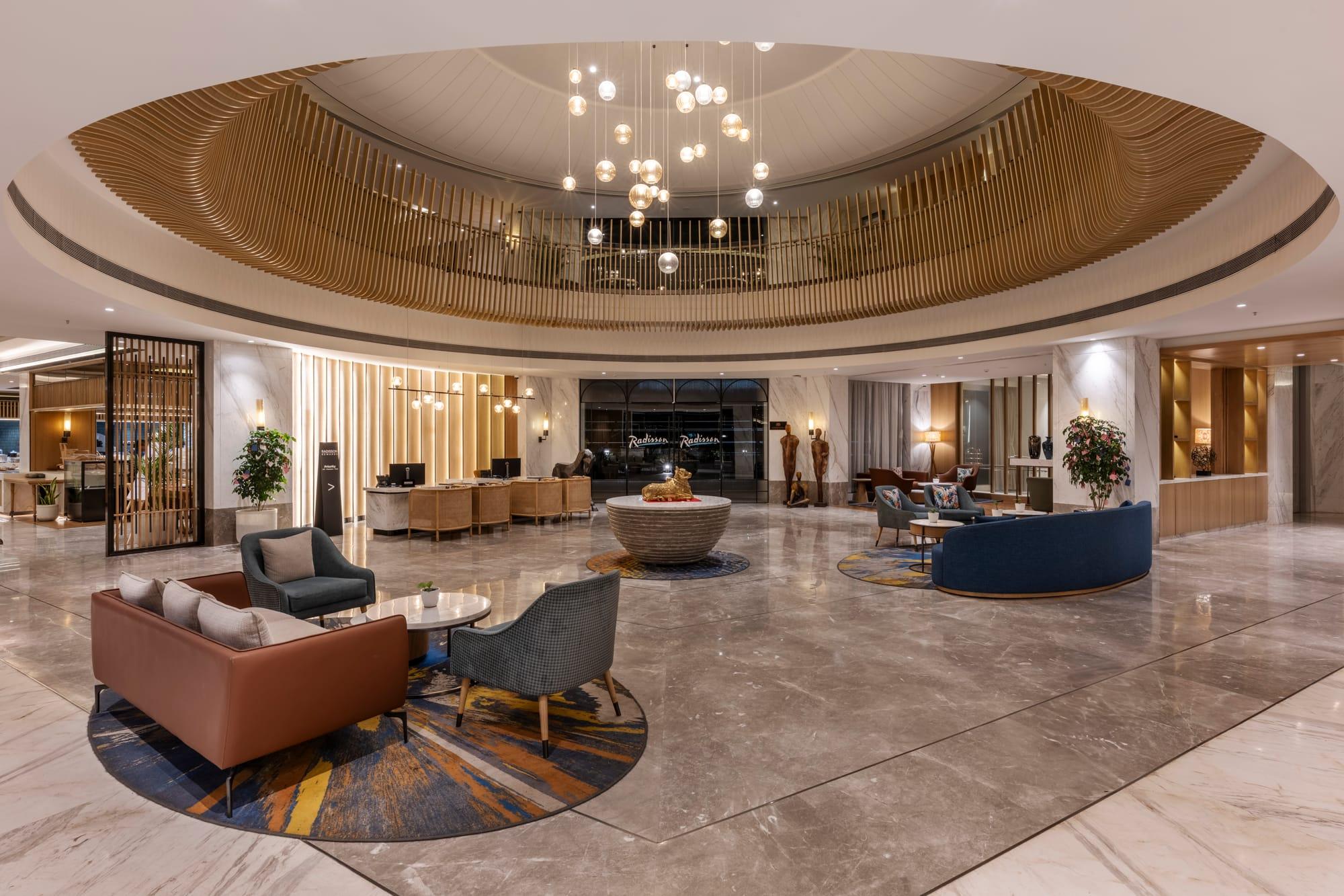 Radisson Resort & Spa, Khopoli — lobby lounge beneath the circular ceiling and chandelier
